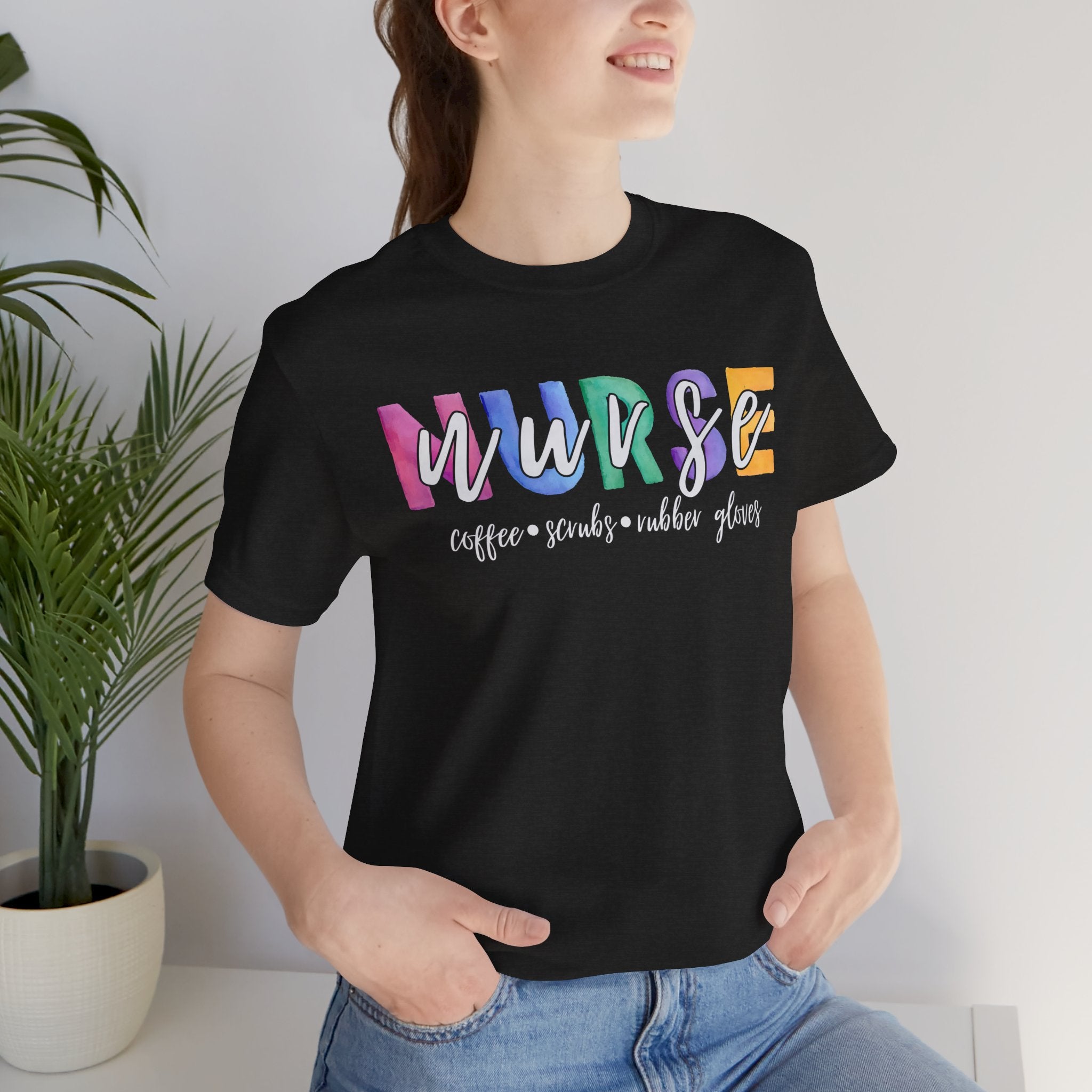 Nurse Rainbow Block Letters Tee — "NURSE" with Coffee, Scrubs, Rubber Gloves Text